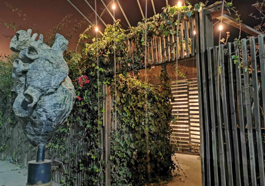 Carved wood bar and mood lighting at Manzanilla Ensenada