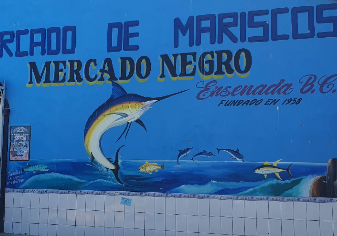 Exterior sign of Mercado Negro de Mariscos at the