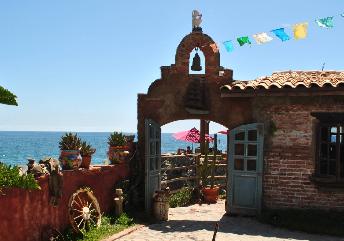 Oceanfront dining at Encanto Restaurante Rosarito, waves crashing below